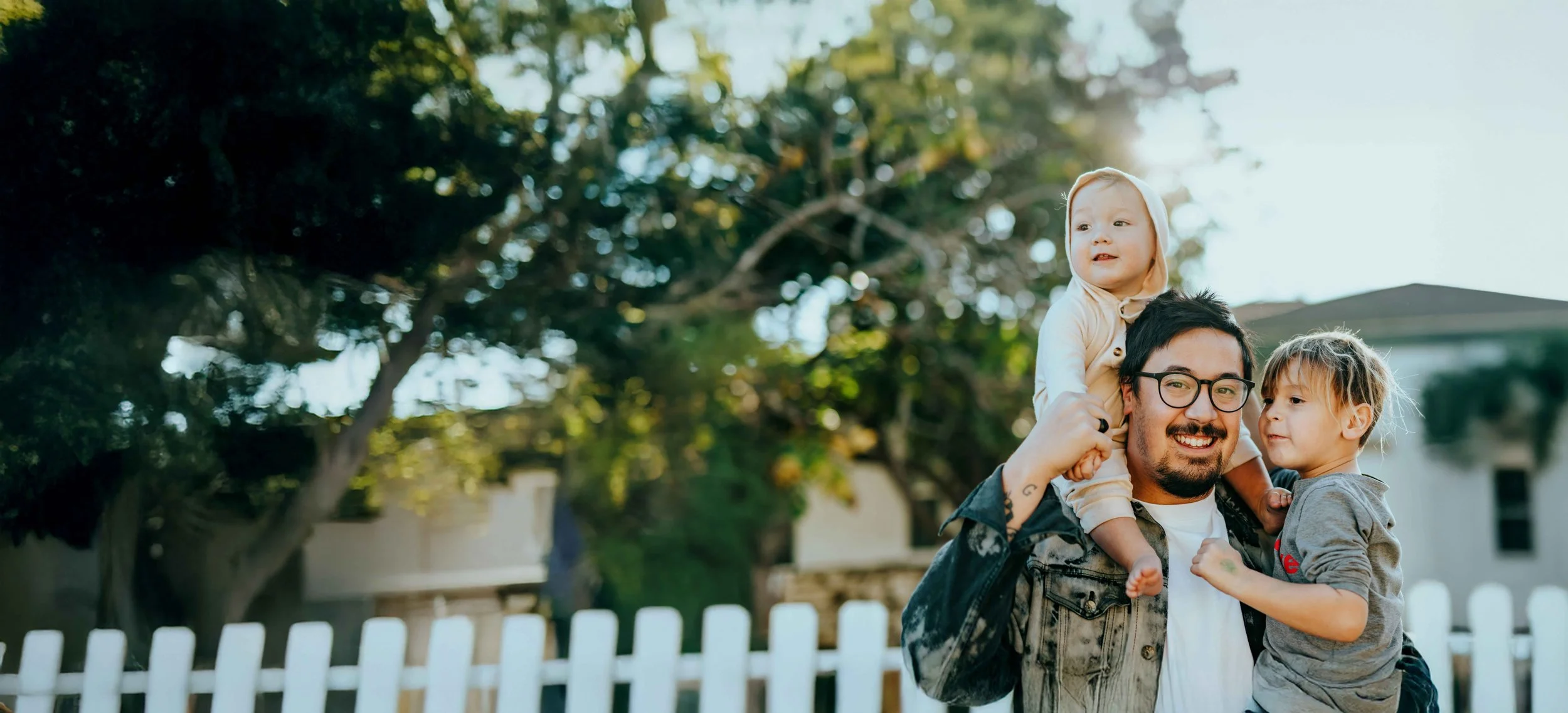 A warm, sunlit family moment.